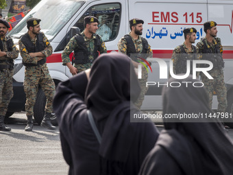 Iranian special police forces are monitoring an area during a funeral ceremony for Hamas leader Ismail Haniyeh and his bodyguard Abu Shaaban...