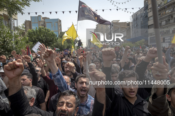 Iranian mourners are shouting anti-U.S. and anti-Israeli slogans while participating in a funeral ceremony for Hamas leader Ismail Haniyeh a...