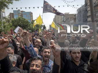 Iranian mourners are shouting anti-U.S. and anti-Israeli slogans while participating in a funeral ceremony for Hamas leader Ismail Haniyeh a...