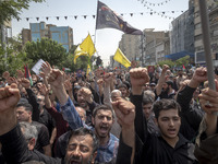 Iranian mourners are shouting anti-U.S. and anti-Israeli slogans while participating in a funeral ceremony for Hamas leader Ismail Haniyeh a...