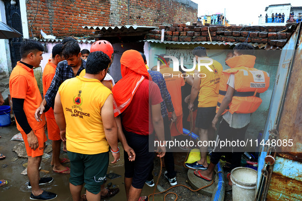 Police and SDRF personnel are conducting a rescue operation after three people drowned in rainwater that entered the basement of their house...