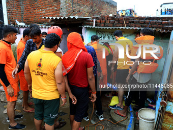 Police and SDRF personnel are conducting a rescue operation after three people drowned in rainwater that entered the basement of their house...