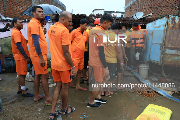 Police and SDRF personnel are conducting a rescue operation after three people drowned in rainwater that entered the basement of their house...