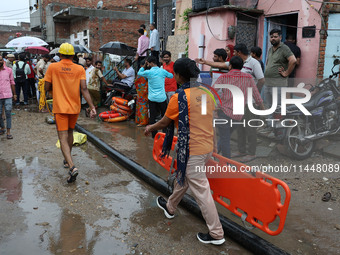 Police and SDRF personnel are conducting a rescue operation after three people drowned in rainwater that entered the basement of their house...