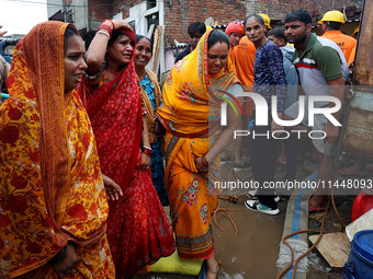 Family members are mourning after three people drowned in rainwater that entered the basement of their house due to heavy rainfall in the VK...