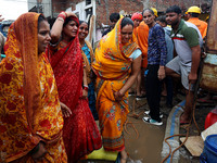 Family members are mourning after three people drowned in rainwater that entered the basement of their house due to heavy rainfall in the VK...