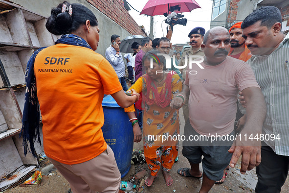 Family members are mourning after three people drowned in rainwater that entered the basement of their house due to heavy rainfall in the VK...