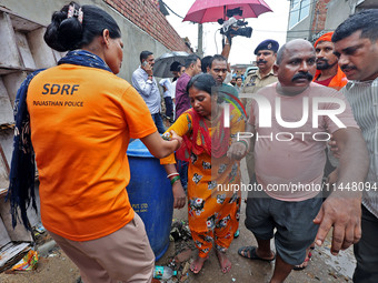 Family members are mourning after three people drowned in rainwater that entered the basement of their house due to heavy rainfall in the VK...