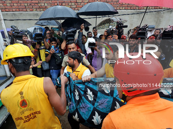 Police and SDRF personnel are conducting a rescue operation after three people drowned in rainwater that entered the basement of their house...