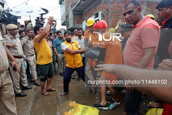 Police and SDRF personnel are conducting a rescue operation after three people drowned in rainwater that entered the basement of their house...