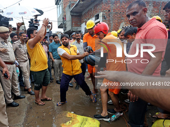 Police and SDRF personnel are conducting a rescue operation after three people drowned in rainwater that entered the basement of their house...