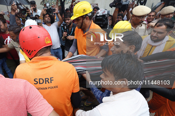 Police and SDRF personnel are conducting a rescue operation after three people drowned in rainwater that entered the basement of their house...