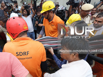 Police and SDRF personnel are conducting a rescue operation after three people drowned in rainwater that entered the basement of their house...