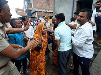 Family members are mourning after three people drowned in rainwater that entered the basement of their house due to heavy rainfall in the VK...