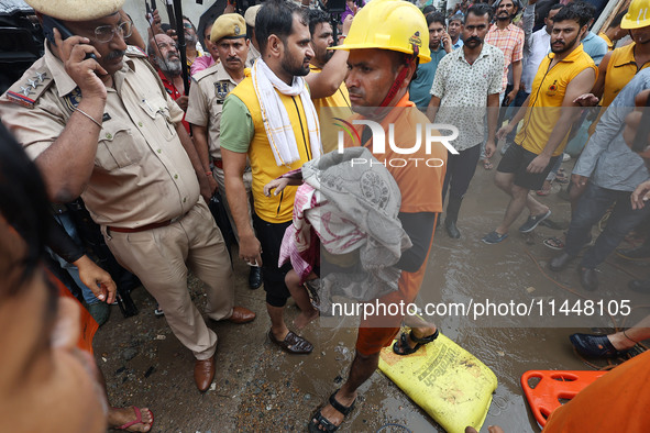 Police and SDRF personnel are conducting a rescue operation after three people drowned in rainwater that entered the basement of their house...