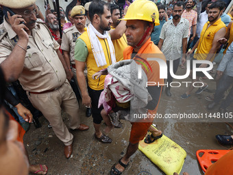 Police and SDRF personnel are conducting a rescue operation after three people drowned in rainwater that entered the basement of their house...