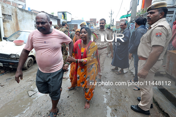 Family members are mourning after three people drowned in rainwater that entered the basement of their house due to heavy rainfall in the VK...