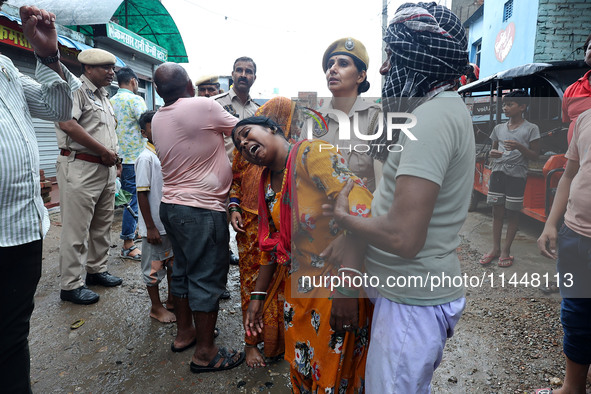 Family members are mourning after three people drowned in rainwater that entered the basement of their house due to heavy rainfall in the VK...