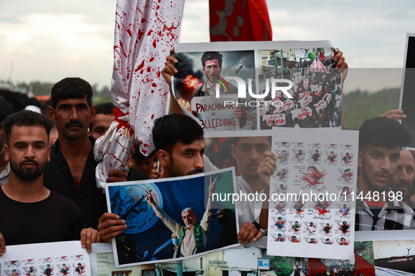 Shia devotees are condemning the killing in Parachinar as they hold Yahya Sinwar's portraits during the 25th Muharram procession in Baramull...