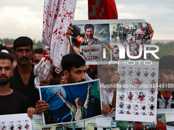 Shia devotees are condemning the killing in Parachinar as they hold Yahya Sinwar's portraits during the 25th Muharram procession in Baramull...