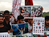 Shia devotees are condemning the killing in Parachinar as they hold Yahya Sinwar's portraits during the 25th Muharram procession in Baramull...