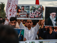 Shia devotees are condemning the killing in Parachinar as they hold Yahya Sinwar's portraits during the 25th Muharram procession in Baramull...