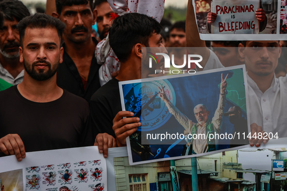 Shia devotees are condemning the killing in Parachinar as they hold Yahya Sinwar's portraits during the 25th Muharram procession in Baramull...