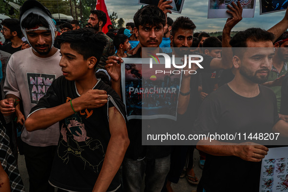 Shia devotees are condemning the killing in Parachinar as they hold Yahya Sinwar's portraits during the 25th Muharram procession in Baramull...