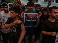 Shia devotees are condemning the killing in Parachinar as they hold Yahya Sinwar's portraits during the 25th Muharram procession in Baramull...