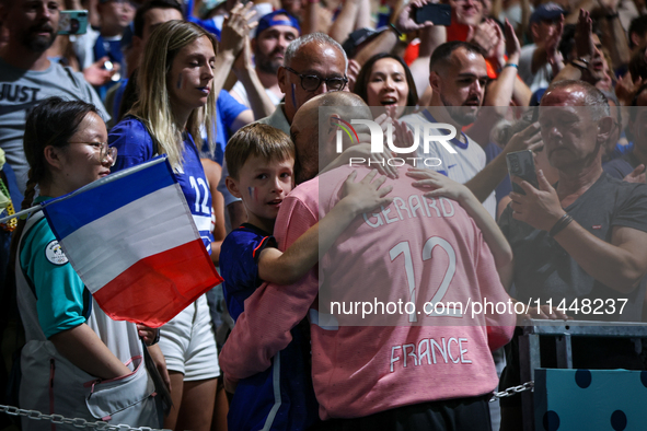 Vincent Gerard, the goalkeeper of the France team, is celebrating with his family after the men's Handball Preliminary Round - Group B match...