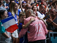 Vincent Gerard, the goalkeeper of the France team, is celebrating with his family after the men's Handball Preliminary Round - Group B match...