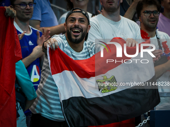 A fan of the Egypt team is cheering during the men's Handball Preliminary Round - Group B match between France and Egypt in Paris, France, o...