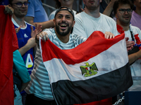 A fan of the Egypt team is cheering during the men's Handball Preliminary Round - Group B match between France and Egypt in Paris, France, o...