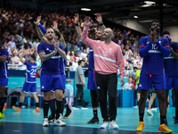 The France team is celebrating after the men's Handball Preliminary Round - Group B match between France and Egypt in Paris, France, on July...