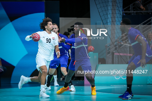 Ali ZEIN of the Egypt Team is playing during the men's Handball Preliminary Round - Group B match between France and Egypt in Paris, France,...