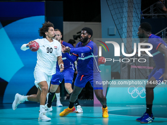 Ali ZEIN of the Egypt Team is playing during the men's Handball Preliminary Round - Group B match between France and Egypt in Paris, France,...