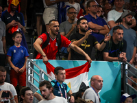 A fan of the Egypt team is cheering during the men's Handball Preliminary Round - Group B match between France and Egypt on Day 5 of the Oly...