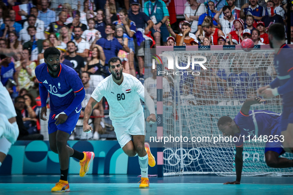 Ahmed ADEL of the Egypt Team is celebrating during the men's Handball Preliminary Round - Group B match between France and Egypt in Paris, F...