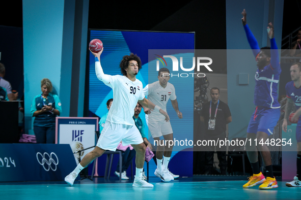 Ali ZEIN of the Egypt Team is playing during the men's Handball Preliminary Round - Group B match between France and Egypt in Paris, France,...