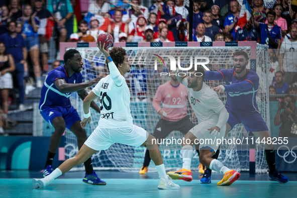 Ali ZEIN of the Egypt Team is playing during the men's Handball Preliminary Round - Group B match between France and Egypt in Paris, France,...