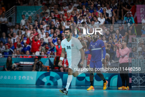 Yehia ELDERAA of the Egypt Team is celebrating during the men's Handball Preliminary Round - Group B match between France and Egypt in Paris...