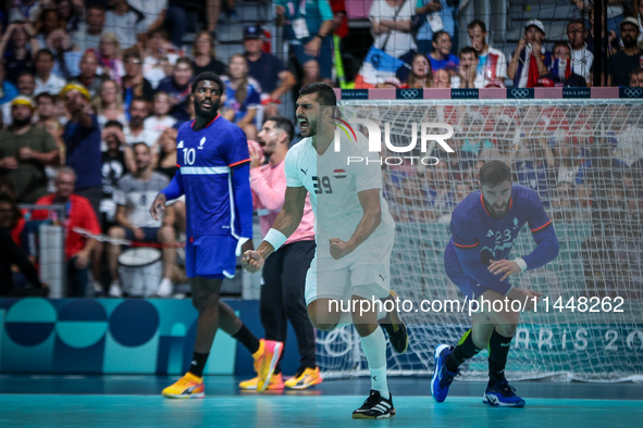 Yehia ELDERAA of the Egypt Team is celebrating during the men's Handball Preliminary Round - Group B match between France and Egypt in Paris...