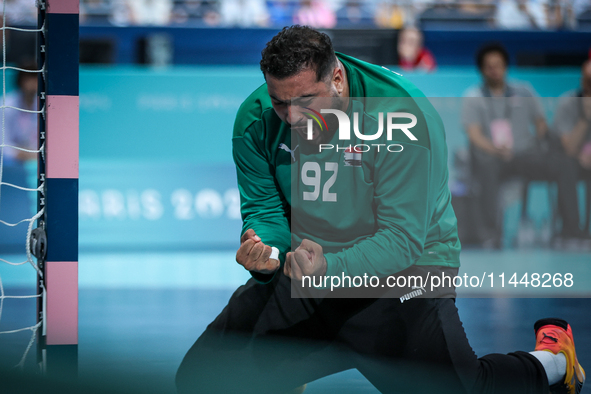 Mohamed ALY, goalkeeper of the Egypt team, is celebrating during the men's Handball Preliminary Round - Group B match between France and Egy...