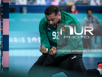 Mohamed ALY, goalkeeper of the Egypt team, is celebrating during the men's Handball Preliminary Round - Group B match between France and Egy...