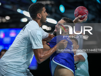 Yahia OMAR of the Egypt team is battling for the ball with Nedim REMILI of the France team during the men's Handball Preliminary Round - Gro...