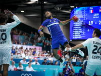 Melvyn Richardson of the France team is shooting at the goal during the men's Handball Preliminary Round - Group B match between France and...