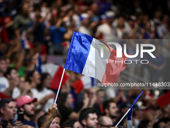 The France flag is flying during the men's Handball Preliminary Round - Group B match between France and Egypt on Day 5 of the Olympic Games...