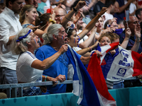 Fans of the France team are cheering during the men's Handball Preliminary Round - Group B match between France and Egypt on Day 5 of the Ol...