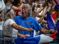 Fans of the France team are cheering during the men's Handball Preliminary Round - Group B match between France and Egypt on Day 5 of the Ol...