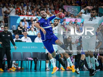 Nedim Remili of the France team is shooting the ball during the Men's Preliminary Round Group B match between France and Egypt in Paris, Fra...